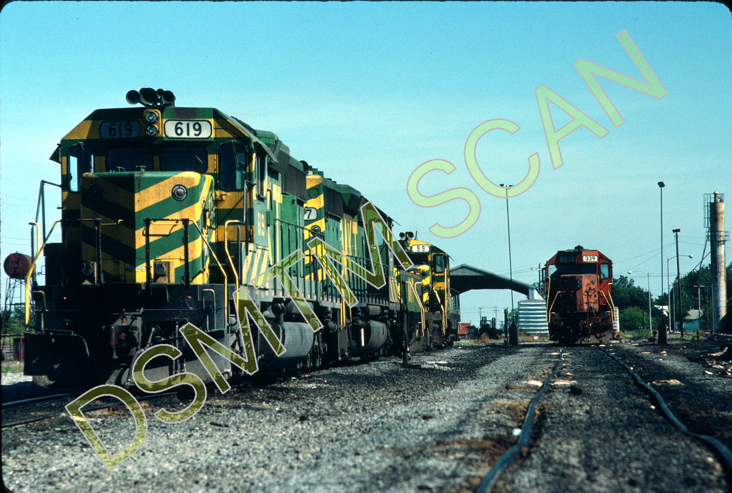 Original Kodachrome Slide, MKT SD40-2 619 plus others line up at Parsons engine house at Parsons, KS